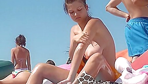Huge big busty natural boobs topless on the public beach! Huge big busty natural boobs topless on the public beach!