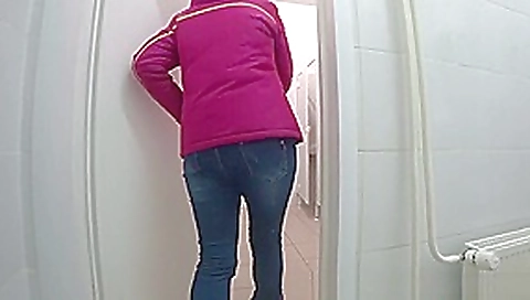 pissing a young girl in a public toilet pissing a young girl in a public toilet